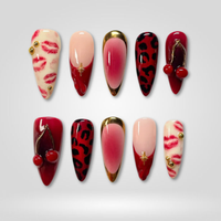 Red Kiss press-on nails — leopard and lip print design