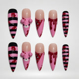Cherry Stripe Mischief press-on nail set with pink, burgundy, black, and nude striped graphic designs.