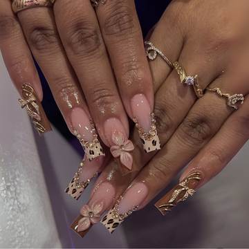 Charm Bloom 3D press-on nails with floral designs and playful accents