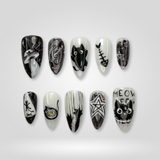 Black Cat press-on nails — funky Y2K design on almond shape