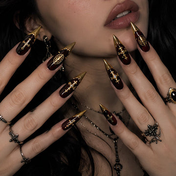 Gilded Eclipse black and gold press-on nails in almond shape - celestial, gothic design