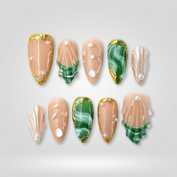 Emerald Glow press-on nails — green marble with gold on almond nails