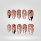 Shell Luxe press-on nails with 3D shell texture, pearls, and gold accents