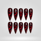 Crimson Leopard red leopard cat eye press-on nails in a stiletto shape - leopard, heart design