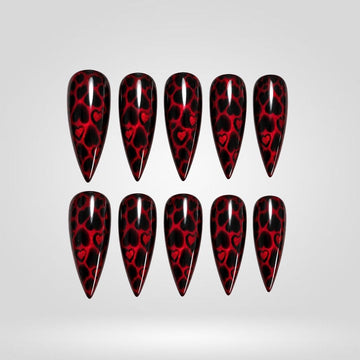 Crimson Leopard press-on nails — red leopard cat eye with hearts on long stiletto