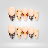 Plaid Star Christmas press-on nails — red plaid and gold star pattern