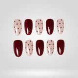 Burgundy Dots press-on nails — deep burgundy with nude and red-dot accents