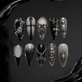 Sacred Shadow gothic press-on nails with skulls and celestial ornaments in black