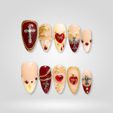 Royal Faith Christmas press-on nails, featuring burgundy with gold cross and heart charms