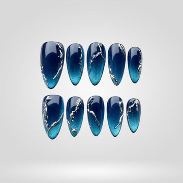 Blue Abyss cat eye press-on nails — deep blue with silver chrome veins