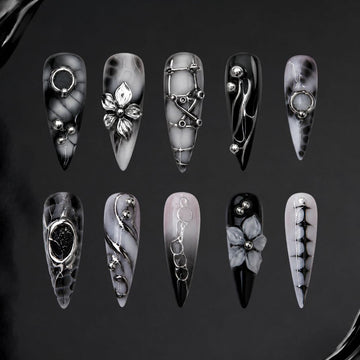 Broken Bloom 3D press-on nails — florals and chains on stiletto nails