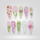 Rosy Drift press-on nails, hand-painted floral design with flowing pink patterns
