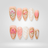 Soft Halo 3D press-on nails with delicate pastel tones and raised details
