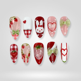 Heart Whisper press-on nails — minimal pink hearts on nude base