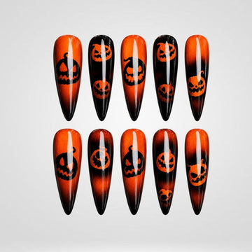 Shadow Glow pumpkin ombre cat eye press-on nails with jack-o'-lantern faces