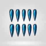 Siren Spikes teal chrome cat eye press-on nails in a stiletto shape - chrome, studded design