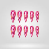 Candy Crypt pink checker cat eye press-on nails in a stiletto shape - checkerboard, glitter design