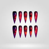 Crimson Omen red bat cat eye press-on nails in a stiletto shape - bat, ombre design
