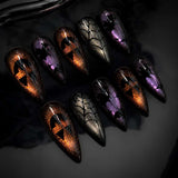 Amber Witch witch and web cat eye press-on nails in a stiletto shape - witch, spider web, glitter design