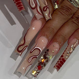 Molten Gold press-on nails with chocolate swirl accents