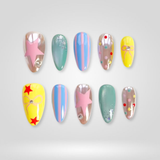 Star Pop press-on nails with pastel stars and striped design