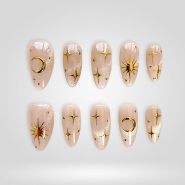 Golden Orbit press-on nails with seashell texture and floral art