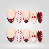 Cherry Dot press-on nails — polka dot design on almond shape