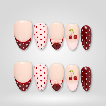 Cherry Dot press-on nails — polka dot design on almond shape