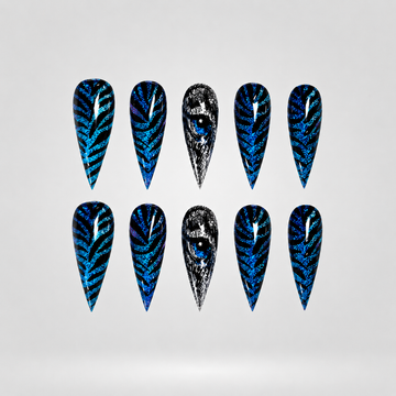 Wild Glow metallic cat eye press-on nails in stiletto shape with chrome and leopard