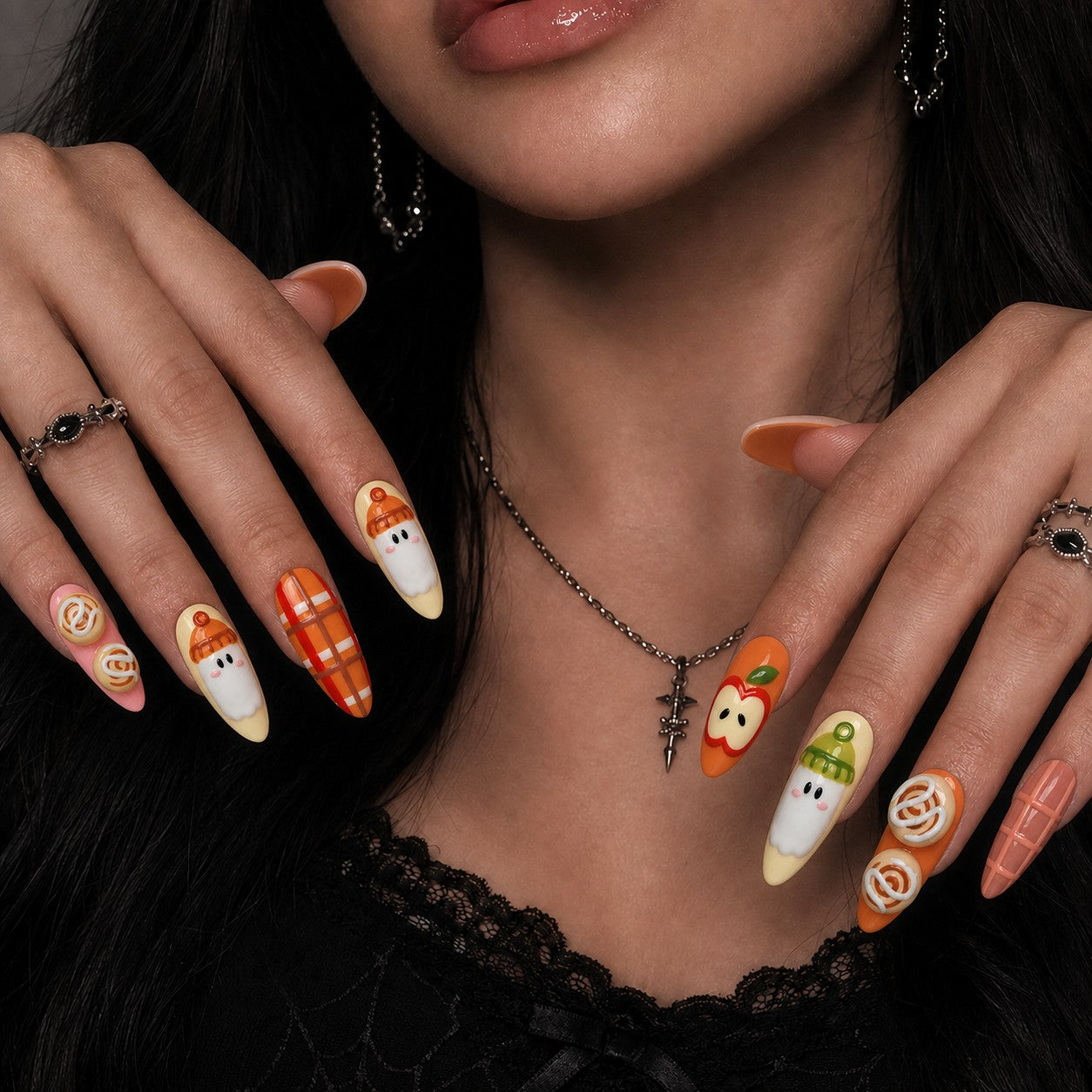 Apple Orchard Boo Halloween press-on nails in almond shape worn on model hand — fall, plaid, ghost nail art