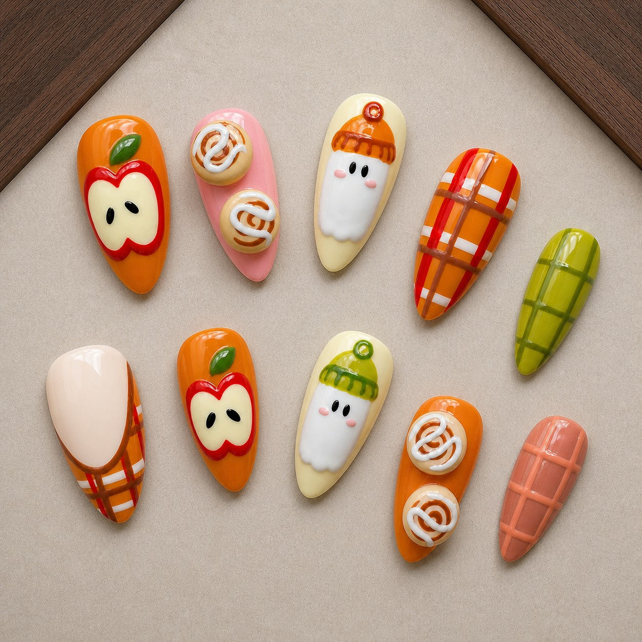Apple Orchard Boo Halloween press-on nail set displayed in a walnut tray — almond shape