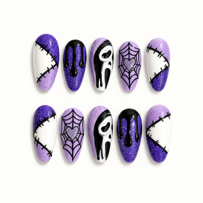 Ten coordinated purple, black, and white press-on nails arranged in two rows, showing glitter ombré, stitched panels, black drips, webbed hearts, and abstract mask-inspired art.