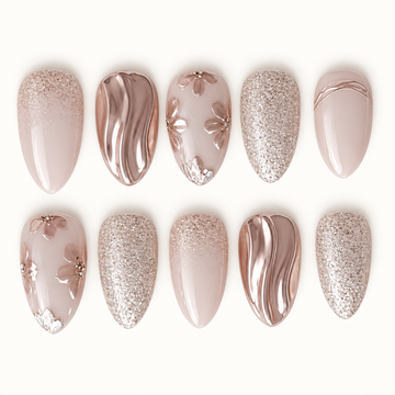 Ten nails arranged in two rows on a light background, featuring beige-pink bases, raised flowers, champagne glitter, and reflective metallic waves.