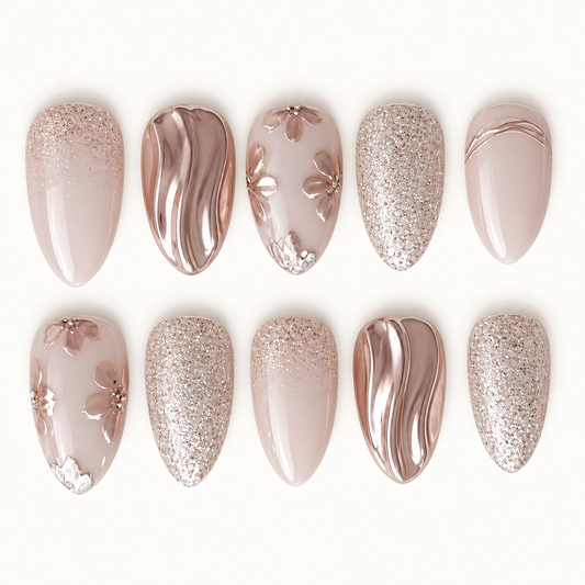 Ten nails arranged in two rows on a light background, featuring beige-pink bases, raised flowers, champagne glitter, and reflective metallic waves.