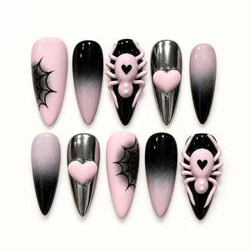 Blush pink, black, and silver-toned chrome press-on nails with web art, hearts, and raised pink spider accents.