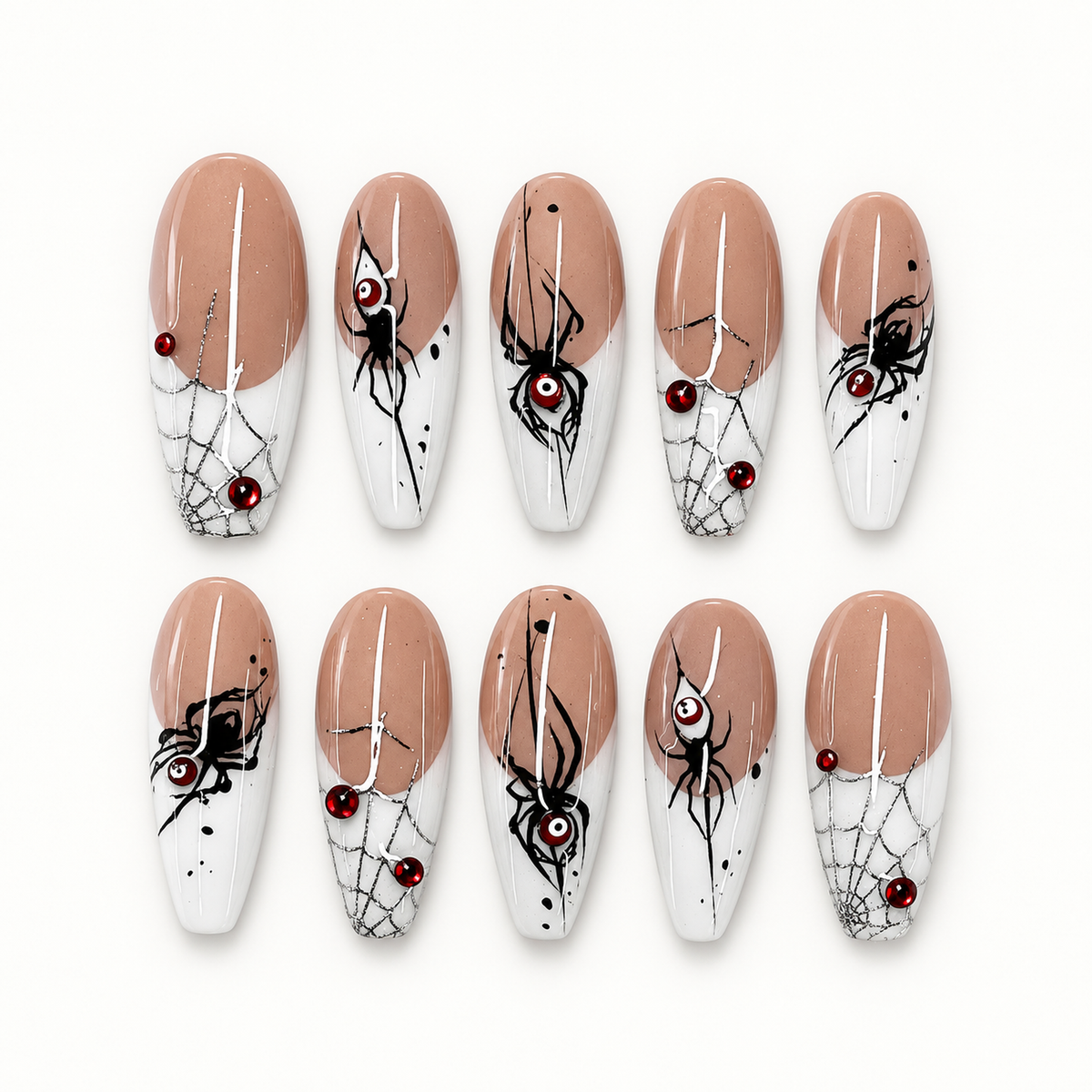 Ten glossy greige and pale-tip press-on nails with black spider silhouettes, cobweb linework, and deep red gem-like accents.