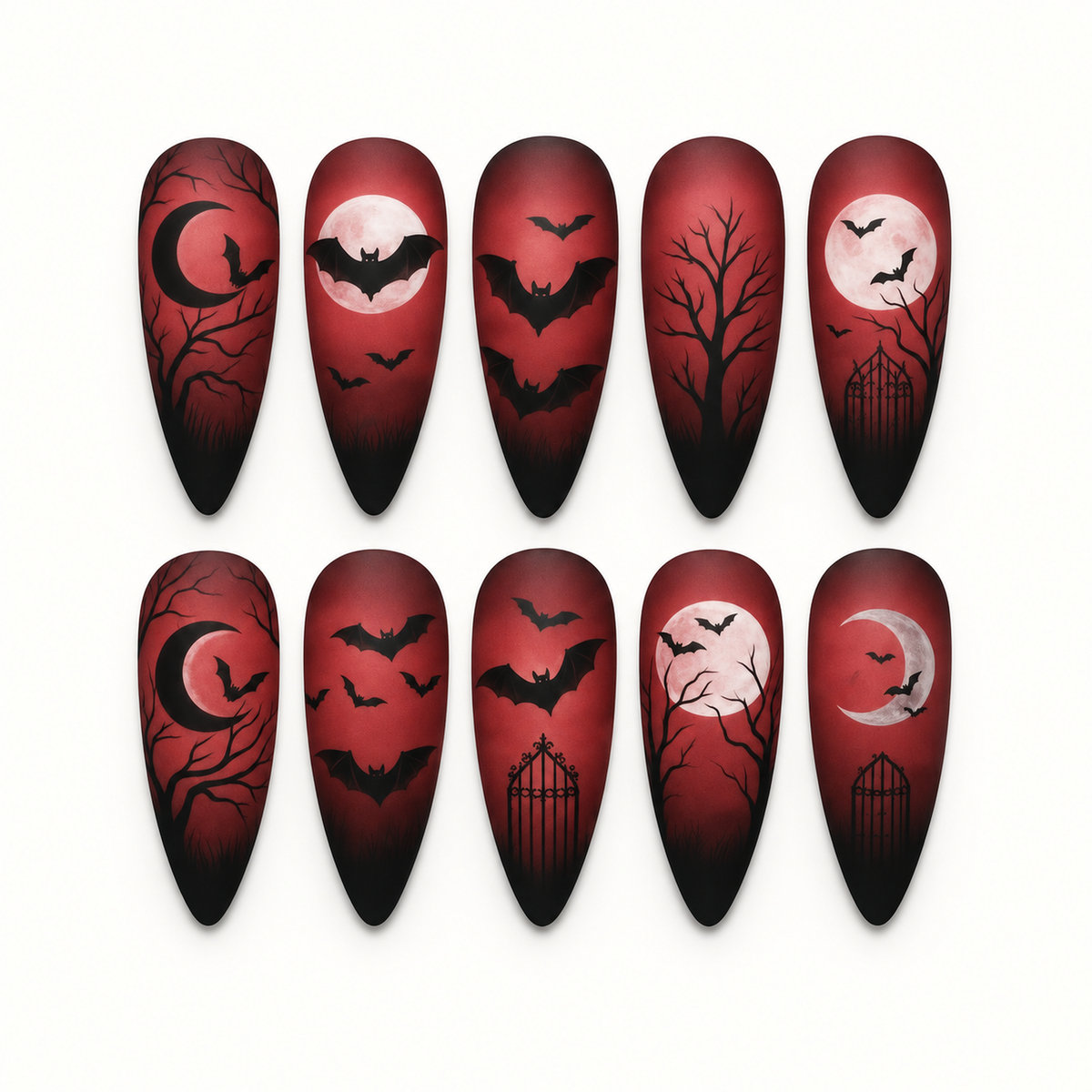 Ten crimson-to-black gothic press-on nails with bats, moons, bare branches, and gate silhouettes arranged on a light neutral background.