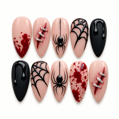 Crimson Web press-on nail set with nude, glossy black, and deep red designs featuring raised spiders, web linework, splatter, and slash-like accents.
