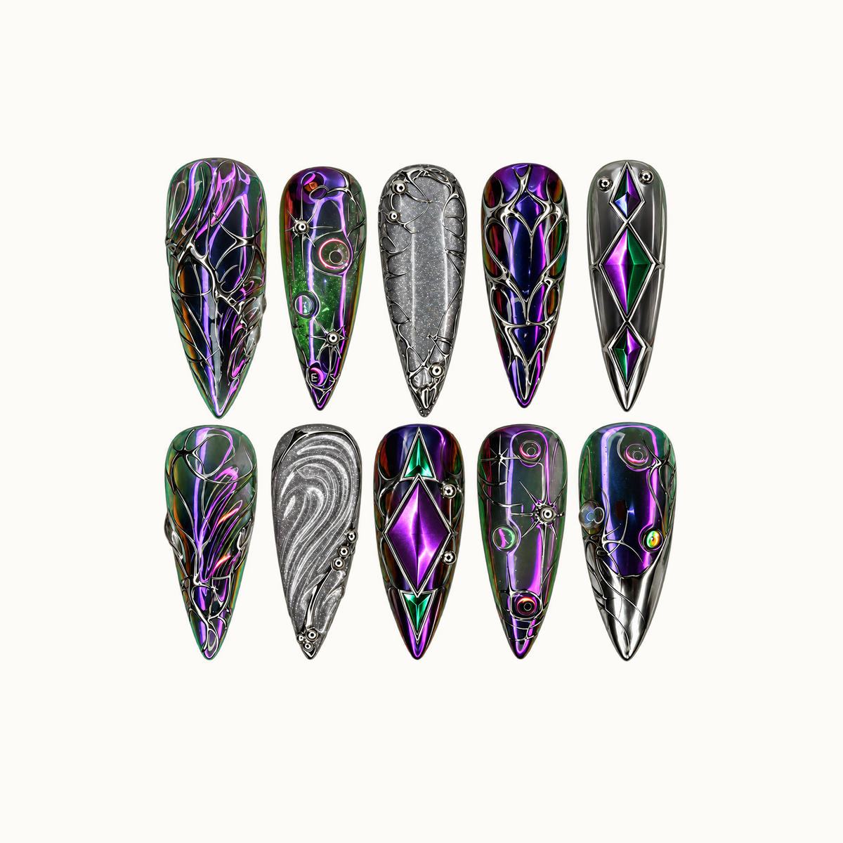 Ten pointed nails arranged in two rows on a light neutral background, featuring purple and green reflections, silver scrollwork, diamond motifs, and silver-gray accents.