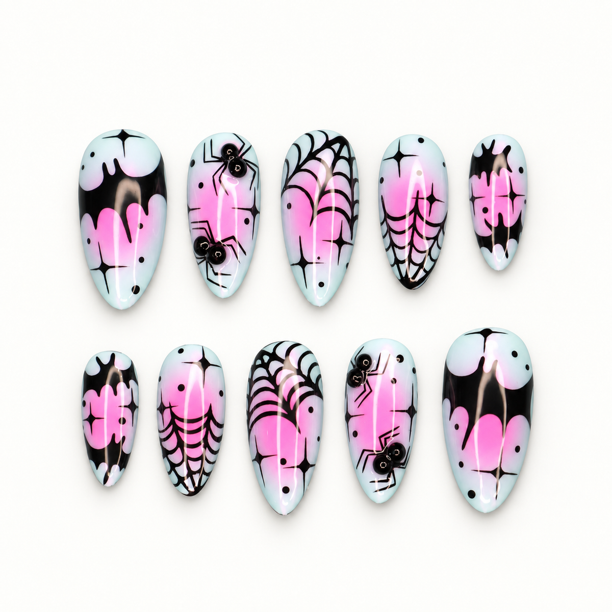 Ten glossy press-on nails with black spiderwebs, spiders, bright pink drips, dots, and starbursts on a pale base