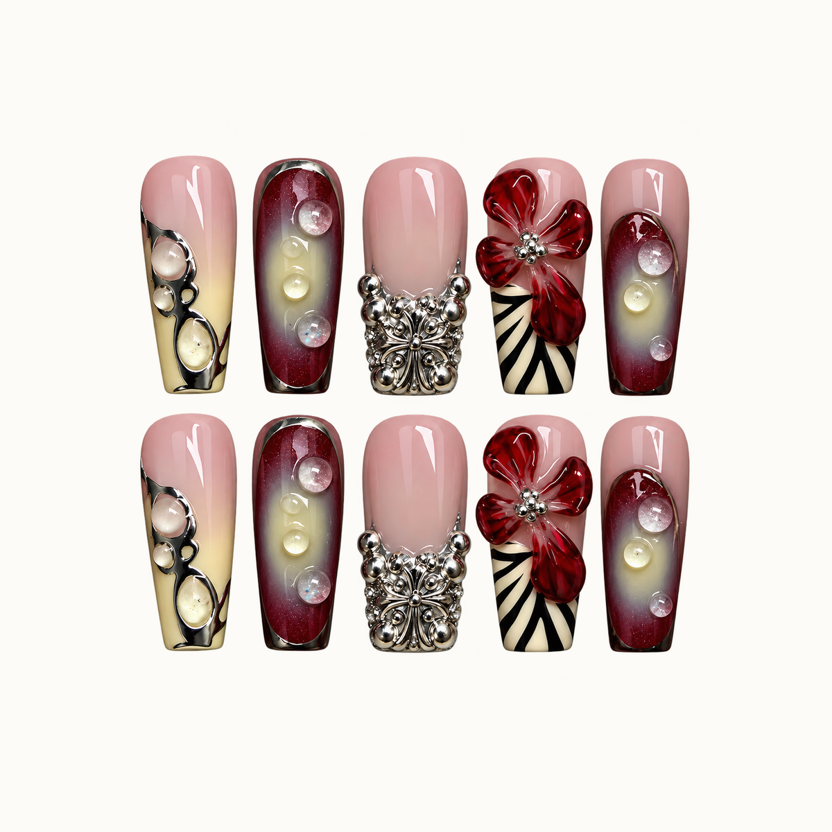 Ten coordinated nails arranged in two rows on a light neutral background, featuring blush pink, burgundy gradients, red flowers, raised droplets, and silver-tone accents.
