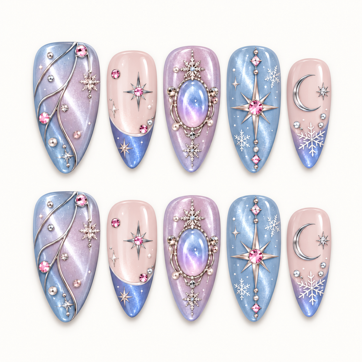 Ten pastel blue, lilac, and blush pink nails arranged in two rows, decorated with moons, stars, snowflakes, and jewel-like accents on a light background.