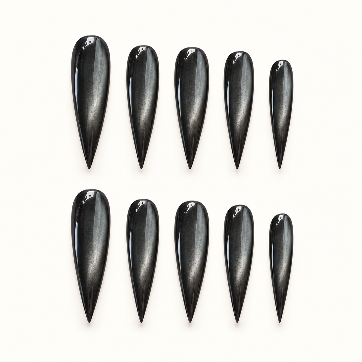 Obsidian Pearl press-on nail set with glossy black polish and smoky pewter cat-eye shimmer.