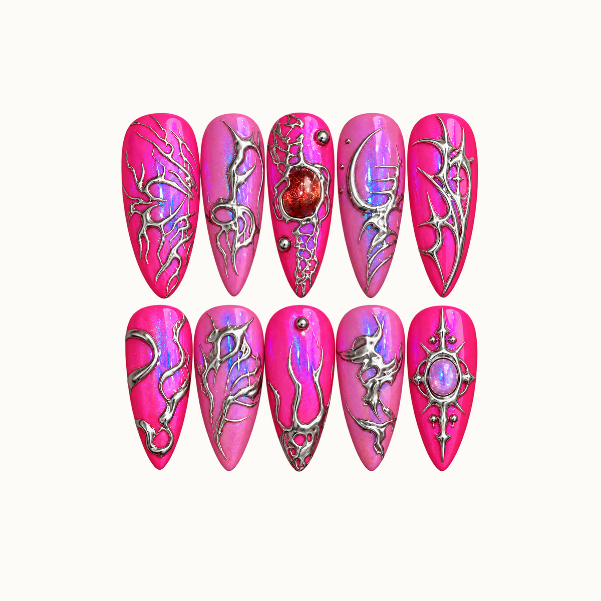 Ten pink nails arranged in two rows on a light neutral background, with iridescent shimmer, silver-toned branching patterns, and red and lavender jewel-like accents.