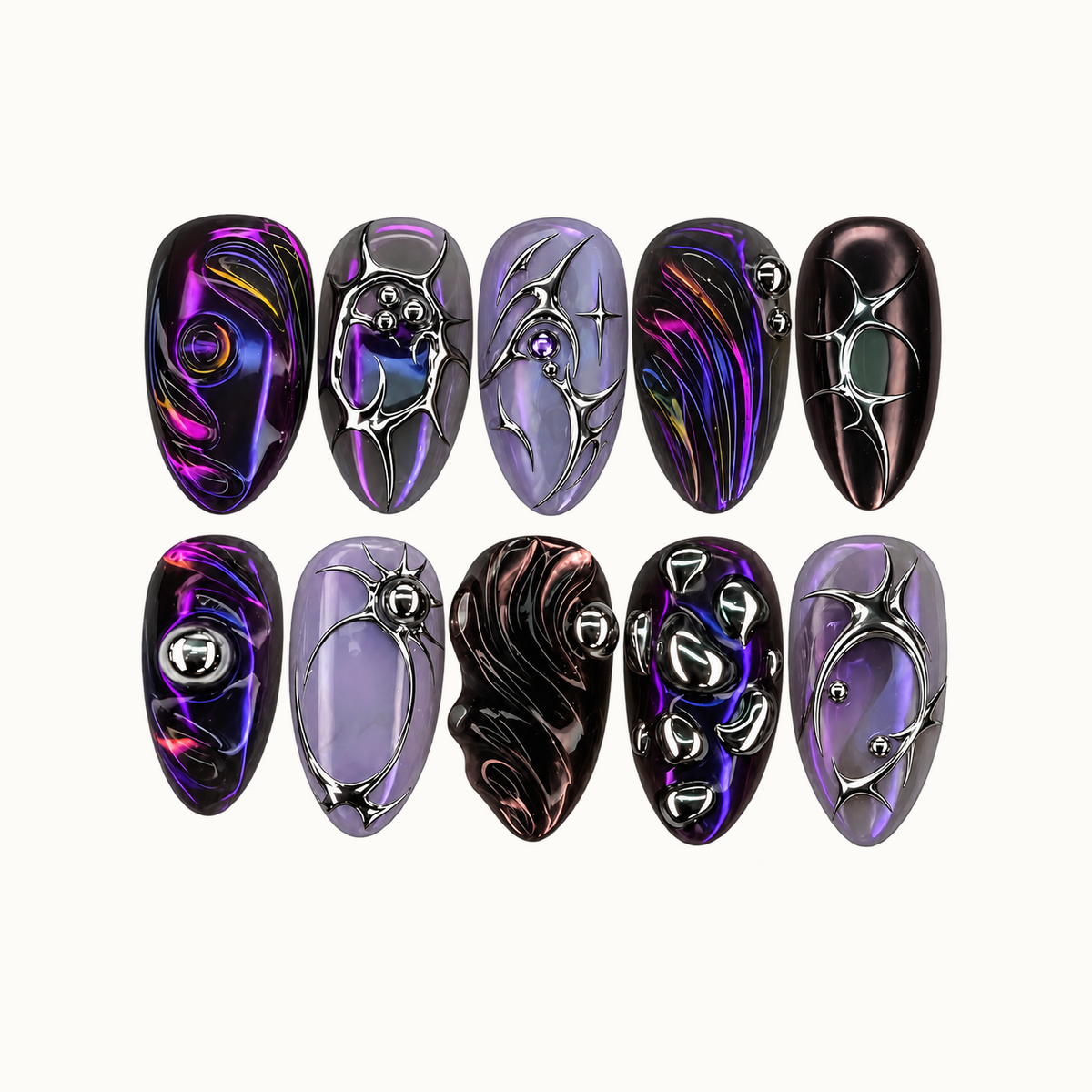 Ten violet, near-black, and smoky lavender nails arranged in two rows on a light neutral background, featuring silver-tone frames, starbursts, beads, and flowing colored lines.
