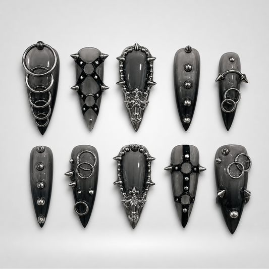 Steel Coven gothic press-on nails with silver rings, studs and spikes on black base
