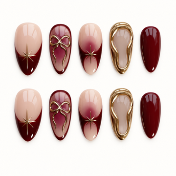 Ten burgundy and blush nude nails arranged in two rows on a light background, featuring gold bows, starbursts, and layered gold borders.