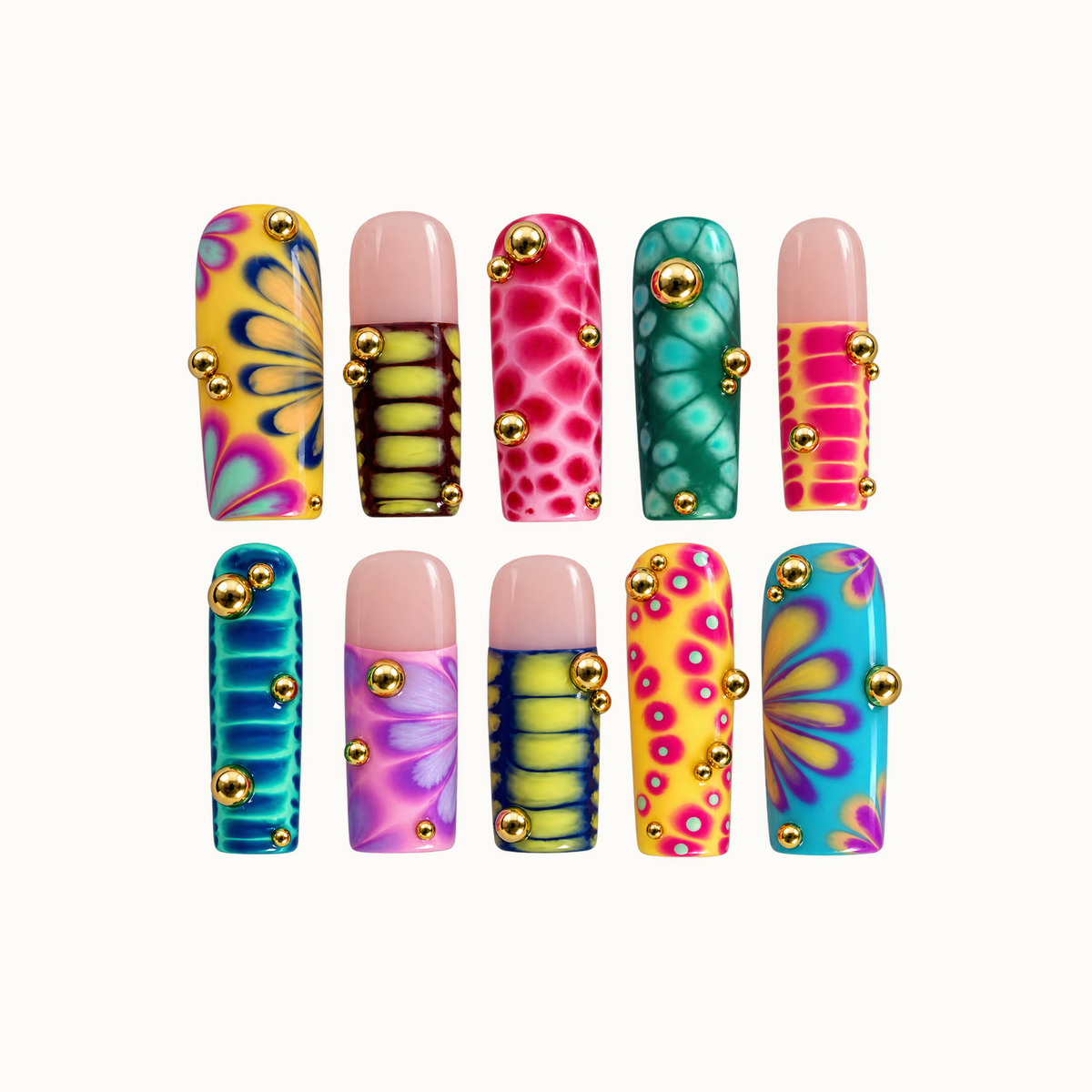 Ten colorful nails arranged in two rows on a light background, featuring floral fans, abstract patterns, blush-pink sections, and gold-tone beads.