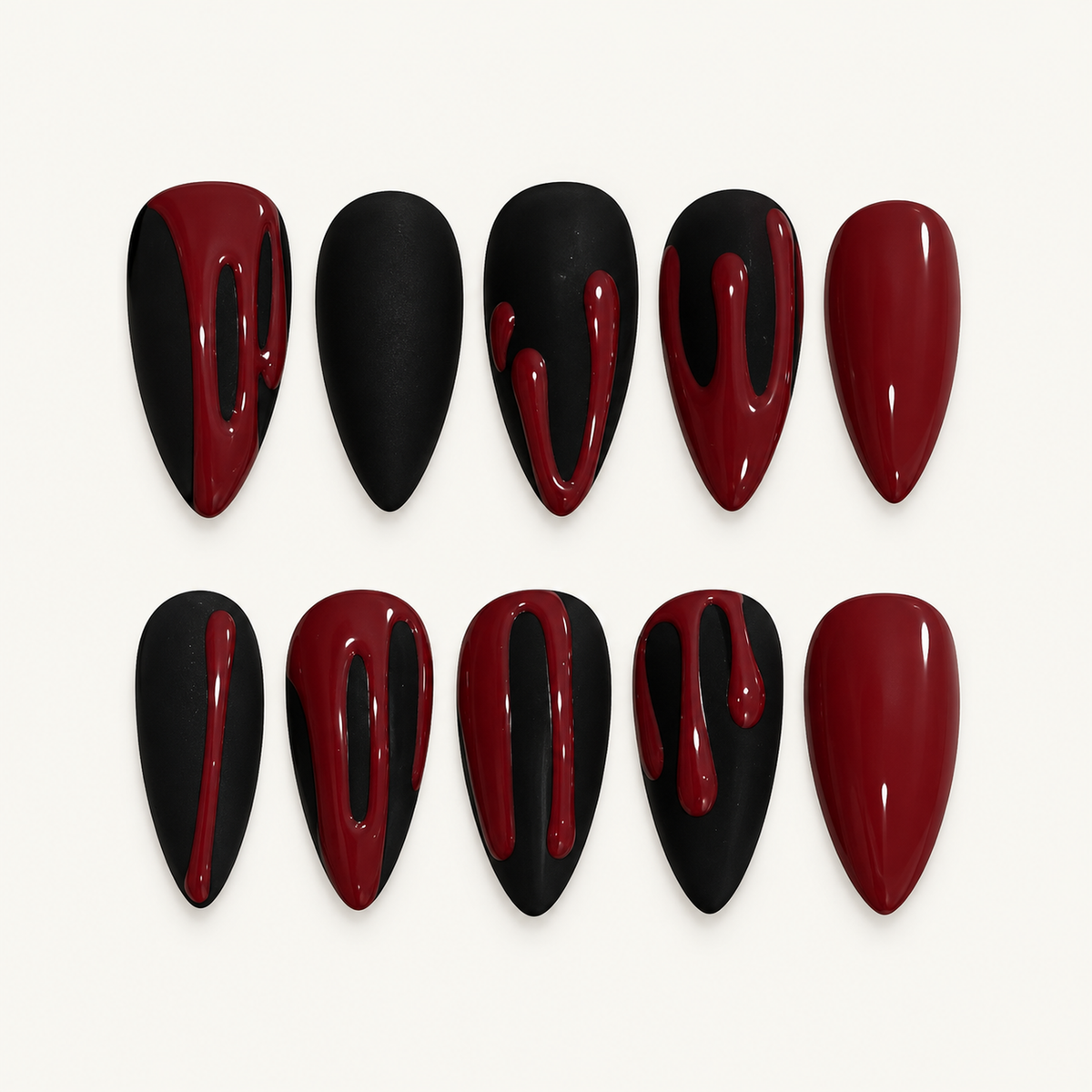 Crimson Drip press-on nails arranged on a neutral display card, showing glossy deep-red and black nails with crimson drip accents.