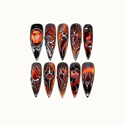 Ten pointed Molten Chrome nails arranged in two rows on a light neutral background, with smoky red-orange bases and silver chrome-look details.